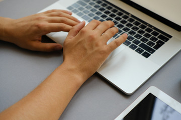 hands on the background of the computer. gray background