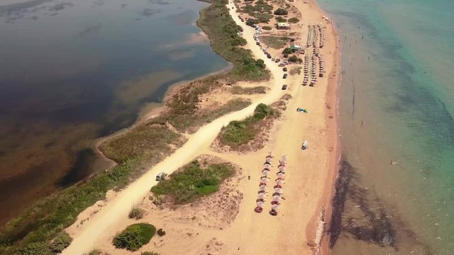Aerial drone video of iconic lake of Korission a natural preserve and beach of Halikounas, Corfu island, Ionian, Greece
