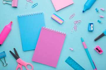School accessories on blue background. Back to school concept, minimalism
