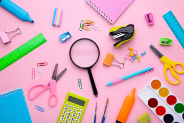 Back to school concept on pink background, top view