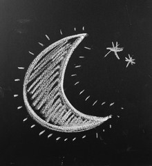 Moon drawn on blackboard, chalkboard background and texture
