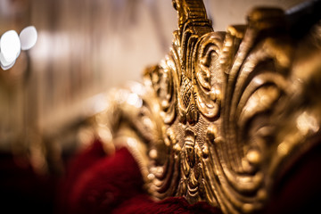 Red cloth and gold pattern decorated on the sofa