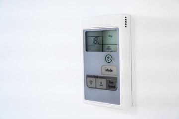 Air conditioning control panel on the wall. Close-up view.