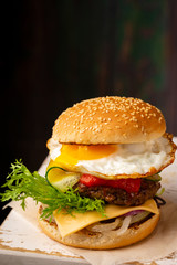Cheeseburger with beef and red sauce