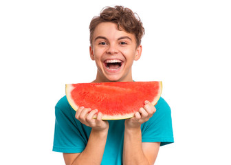 Portrait of teen boy eating ripe juicy watermelon and smiling. Cute caucasian young teenager, isolated on white background. Funny happy child with slice red watermelon laughing and looking at camera.