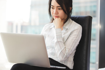 Beautiful business woman using a laptop computer.