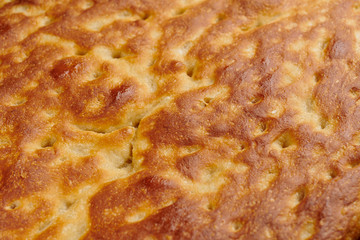 Italian focaccia bread on a baking tray