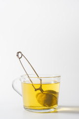 A cup of Chamomile tea in a clear glass mug