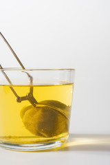 A cup of Chamomile tea in a clear glass mug