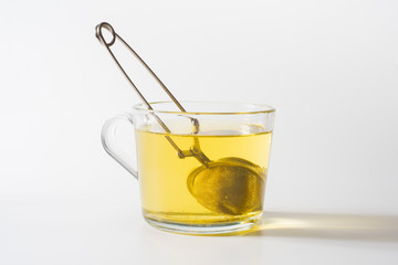 A cup of Chamomile tea in a clear glass mug