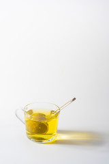 A cup of Chamomile tea in a clear glass mug