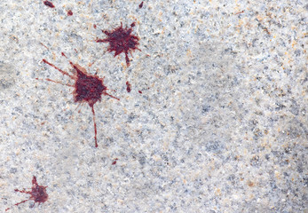 Drops of real Blood on a road, blood splatter on road in city, as background