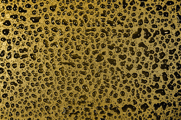 Abstract black liquid photos on a golden yellow background