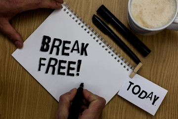 Writing note showing Break Free. Business photo showcasing another way of saying salvation out of chains freedom prison Man holding marker notebook clothepin reminder wooden table cup coffee