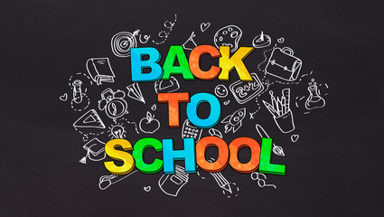 Big banner with colored Back to school text and stationery icons