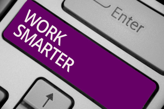 Text sign showing Work Smarter. Conceptual photo Efficiency Be clever in your job Make successful strategies Keyboard purple key Intention create computer computing reflection document