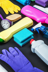 various cleaning products for the house on a black background.