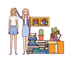 women standing with bookshelf of wooden and books