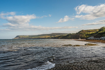 coast of sea with sky and clouds