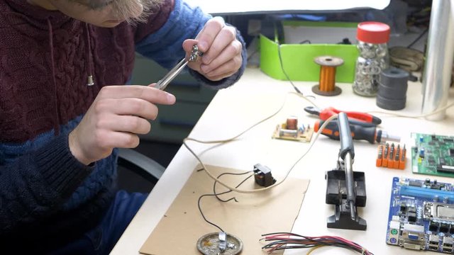 Home Devices Laboratory. Workplace with electronic components in electronics workshop. Repair Shop and Electronic Devices Concept