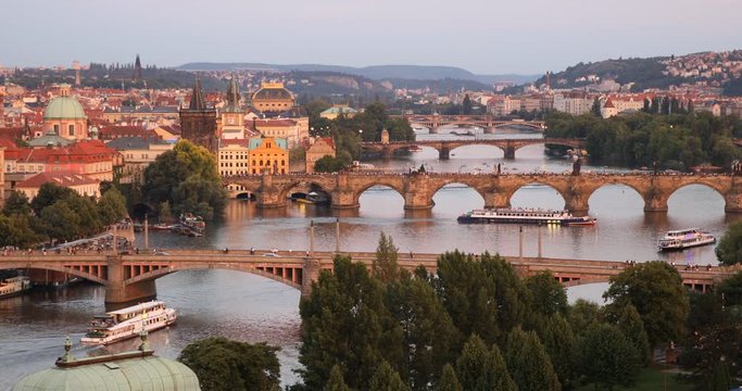Scenic summer sunset aerial view of the Prague Old Town pier architecture and Charles Bridge over Vltava river in Prague, Czech Republic