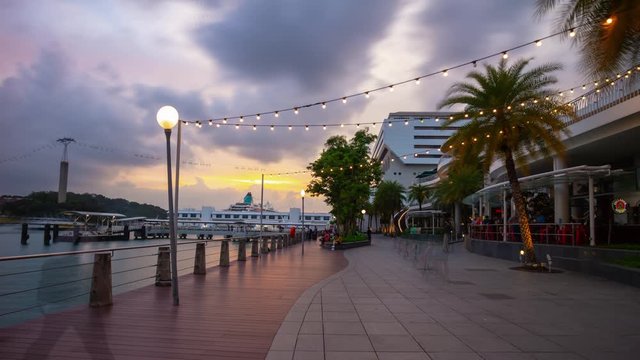 sunset illumination singapore city sentosa island famous mall bay panorama 4k timelapse
