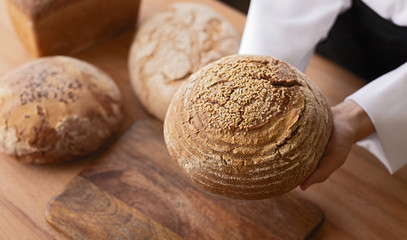 Crop hands showing bread