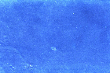 Cardboard texture close-up. Dark old paper background. Grunge concrete wall. Vintage blank wallpaper.