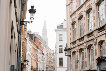 Fototapeta na wymiar Editorial. Bruxelles, Belgium - May 2019: view of the beautiful old brussels street in rainy foggy weather