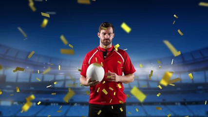 Professional rugby player standing in front of a stadium