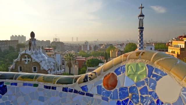 Foggy morning Barcelona city, Spain lit by sun. Shot from Park Guell. Crane shot, 4K
