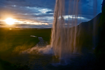 Seljalandsfoss waterfall at sunset. Iceland