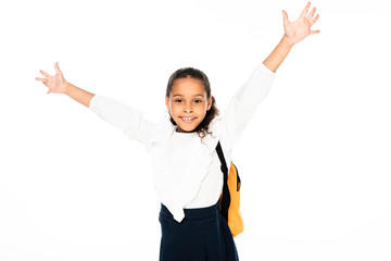 happy african american american schoolgirl gesturing with raised hands while looking at camera isolated on white