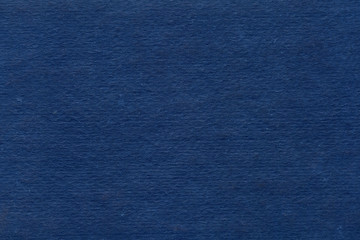 Cardboard texture close-up. Dark old paper background. Grunge concrete wall. Vintage blank wallpaper.