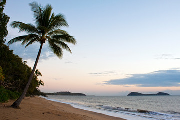 Fototapeta premium Clifton Beach north of Cairns looking towards the popular tourist destination of Palm Cove., Queensland, Australia.