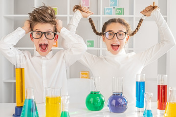 Crazy kids working in chemistry laboratory