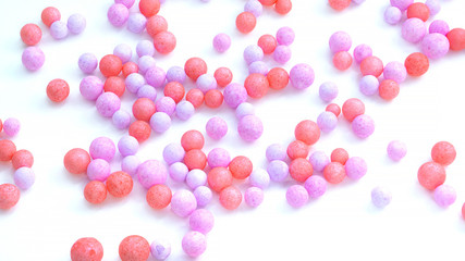 colorful foam beads isolated on white background. wallpaper