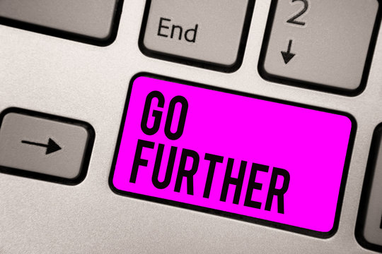 Text sign showing Go Further. Conceptual photo To move to a greater distance or overcome your limitations Keyboard purple key Intention create computer computing reflection document