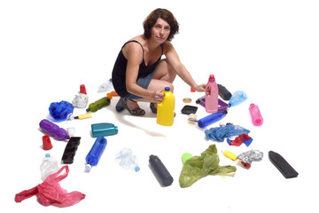 woman showing a plastic bottle in white background