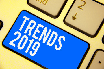 Text sign showing Trends 2019. Conceptual photo Upcoming year prevailing tendency Widely Discussed Online Keyboard blue key Intention create computer computing reflection document