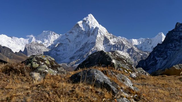 Himalaya, Nepal. View of snowy Mount Ama Dablam. Trek to the Everest Base Camp. Crane shot, 4K
