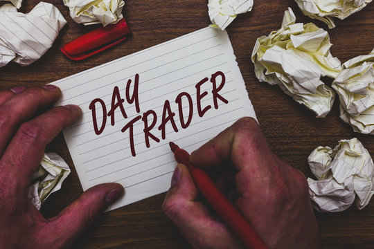Handwriting text writing Day Trader. Concept meaning A person that buy and sell financial instrument within the day Man holding marker notebook page crumpled papers several tries mistakes