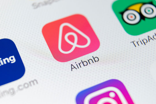 Sankt-Petersburg, Russia, February 9, 2018: Airbnb application icon on Apple iPhone X screen close-up. Airbnb app icon. Airbnb.com is online website for booking rooms. social media network.