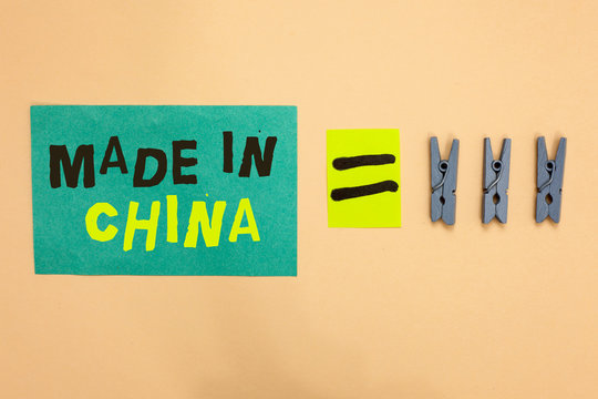 Handwriting text Made In China. Concept meaning Wholesale Industry Marketplace Global Trade Asian Commerce Turquoise paper reminder equal sign several clothespins sending message