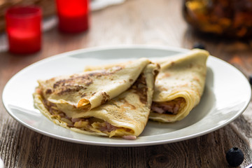pancakes on a plate with ham