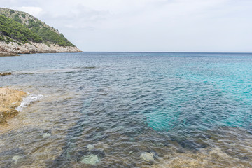 turquoise Mediterranean sea waters on the beaches of the island of Mallorca, Balearic Islands, Spain