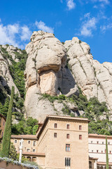 Fototapeta na wymiar Sanctuary of Our Lady of Montserrat, place of worship on top of the mountain. Montserrat is a rock massif traditionally considered the most important and significant mountain in Catalonia, Spain