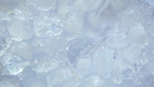 Water is pouring on crushed ice. Concept refresh