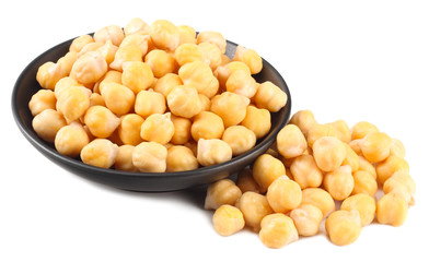 chickpeas in black bowl isolated on white background
