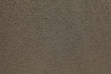 Asphalt surface. Detailed texture background of the bitumen at the sunset